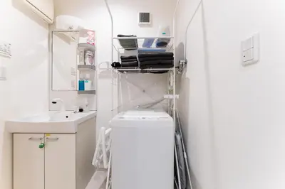a small bathroom with a toilet and a sink at Shinagawa Tokyo - Great access to Bullet Train and Haneda in Tokyo