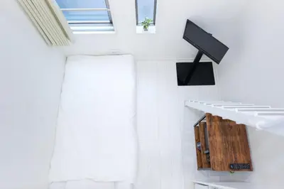 a bathroom with white walls and a window and a shelf at Monthly Studio G2 in Tokyo