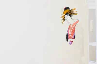 a kite is hanging on a wall at Sakura RYOKAN MEJIRO2 in Tokyo