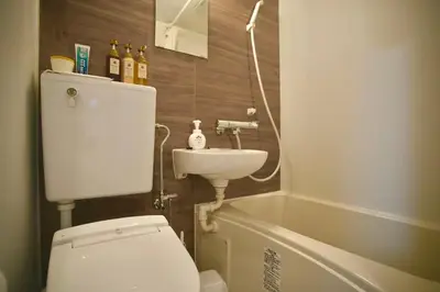 a bathroom with a toilet and a sink and a tub at Shin-Okachimachi I Metro 6 minutes I Direct To Airport in Tokyo