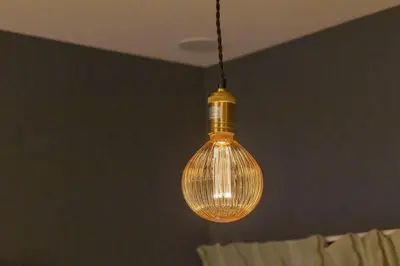 a glass light bulb hanging from a ceiling at \u30a2\u30f3\u30c9\u30b9\u30c6\u30a4\u5f25\u751f\u753a4\u4e01\u76ee201 in Tokyo