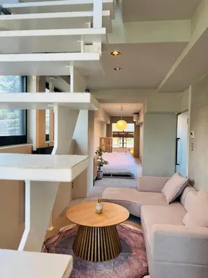 a living room with a couch and a table at Newly opened! Shibuya Mishuku Sky Terrace in Tokyo
