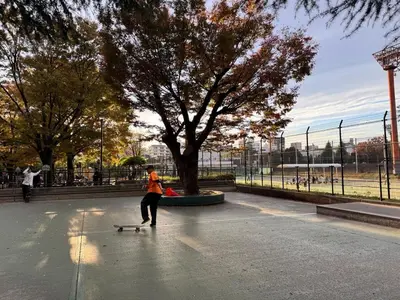 a person riding a skateboard in a park at Newly opened! Shibuya Mishuku Sky Terrace in Tokyo