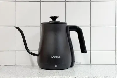 a black electric kettle sitting on a kitchen counter at -Belmazon meguro402- 7 minutes to Shibuya Station in Tokyo