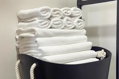 a stack of white towels in a bathroom at -Belmazon meguro402- 7 minutes to Shibuya Station in Tokyo