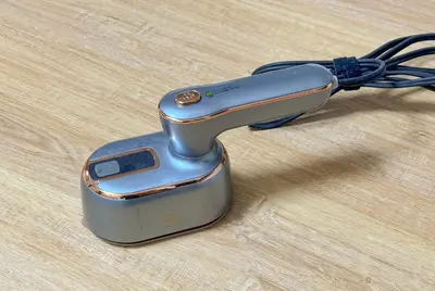 a iron with a cord on a wooden table at -Belmazon meguro402- 7 minutes to Shibuya Station in Tokyo