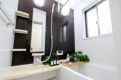 a bathroom with a shower and a mirror at \u5927\u5cf6Villa in Tokyo