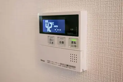 a video game system is attached to a wall at \u5927\u5cf6Villa in Tokyo