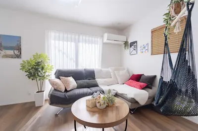 a living room with a couch and a table at Shibuya Base in Tokyo