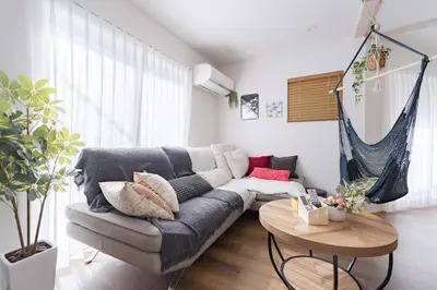 a living room with a couch and a table at Shibuya Base in Tokyo