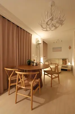 a living room with a table and chairs and a couch at memento 20minutes from Haneda Airport 10minute walk from JR Kamata Station in Tokyo