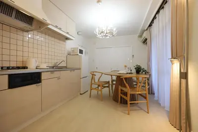 a kitchen with a table and a dining room at memento 20minutes from Haneda Airport 10minute walk from JR Kamata Station in Tokyo