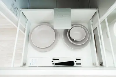 a bathroom with a toilet and a remote control at Sunlit Canopy - A Cozy Stay in Tokyo Shinjuku Area, with Easy City Access to Shibuya in Tokyo