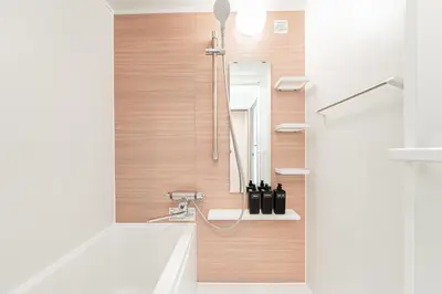 a bathroom with a shower with a sink at Sunlit Canopy - A Cozy Stay in Tokyo Shinjuku Area, with Easy City Access to Shibuya in Tokyo