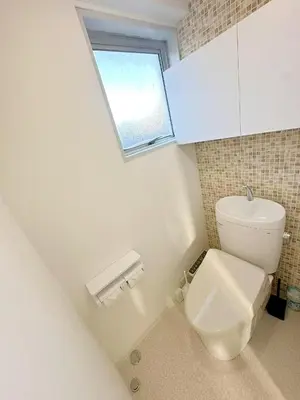 a bathroom with a toilet and a window at \u6696\u71c8 DANTO inn 3F in Tokyo