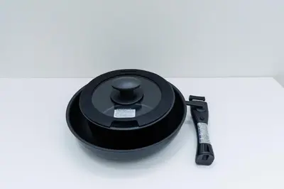 a black pot and a knife on a table at Cruise Inn Kitasenju Station Front2 in Tokyo