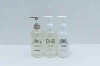 a group of three bottles of soap sitting on a shelf at Cruise Inn Kitasenju Station Front2 in Tokyo