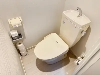 a bathroom with a white toilet and a sink at Cruise Inn Kitasenju Station Front2 in Tokyo