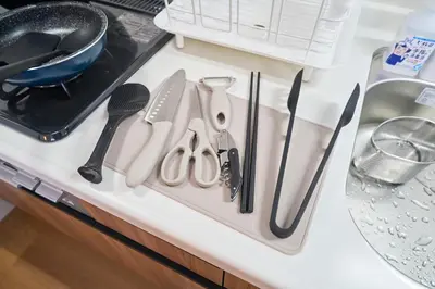 a kitchen counter with utensils on a counter top at Kita-Senju House in Tokyo