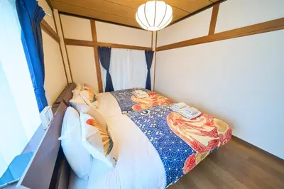 a bed in a room with a canopy bed at Kita-Senju House in Tokyo