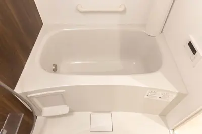 a white toilet with a sink in a bathroom at FABRIC Nishi-Shinjuku in Tokyo