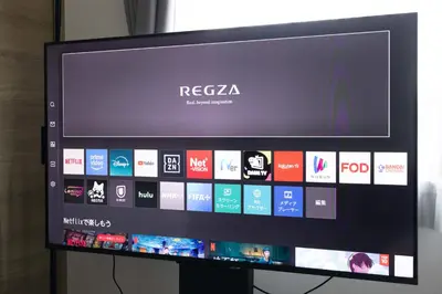 a flat screen tv with areensktopktopktopktop at FABRIC Nishi-Shinjuku in Tokyo