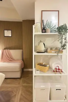 a room with a white book shelf with a bed at PandaStay\u521d\u53f0\u99c5,\u5f92\u6b657\u5206,\u6e0b\u8c37\u30a8\u30ea\u30a2\u8cb8\u5207\u90e8\u5c4b in Tokyo