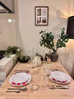 a table with plates and wine glasses on it at PandaStay\u521d\u53f0\u99c5,\u5f92\u6b657\u5206,\u6e0b\u8c37\u30a8\u30ea\u30a2\u8cb8\u5207\u90e8\u5c4b in Tokyo