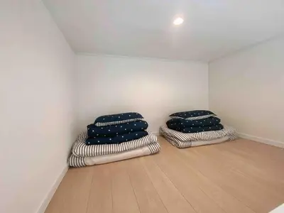 two blue pillows sitting in a corner of a room at Shinjuku 5 min, Shin-Nakano Station 1 min walk, Room 201 in Tokyo