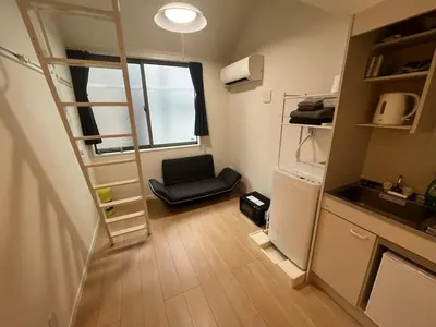 a small room with a stair case and a chair at Shinjuku 5 min, Shin-Nakano Station 1 min walk, Room 201 in Tokyo
