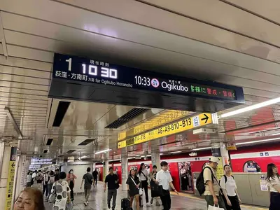 a crowd of people walking in a subway station at Shinjuku 5 min, 1 min walk from Shinnakano Station, Room 202 in Tokyo