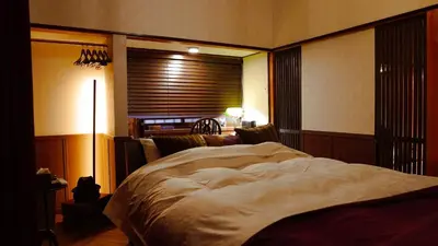 a bedroom with a large bed and a window at Chronos House Tokyo Kitasenju - Time Travel Stay in Tokyo