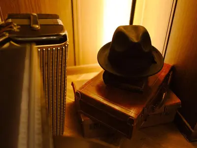 a hat is sitting on top of suitcases at Chronos House Tokyo Kitasenju - Time Travel Stay in Tokyo