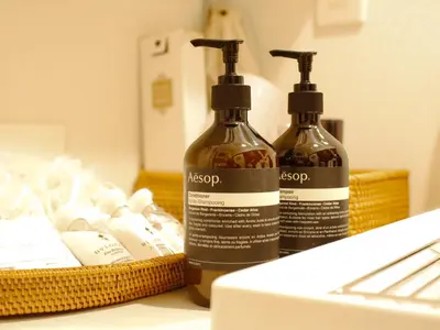 two bottles of soap sitting on top of a counter at Chronos House Tokyo Kitasenju - Time Travel Stay in Tokyo