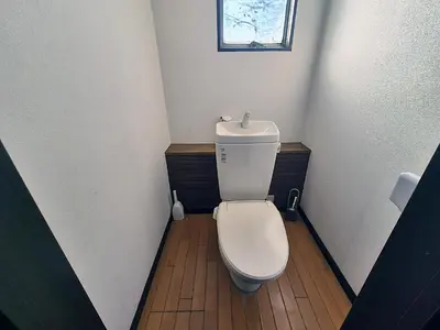 a small bathroom with a white toilet in a room at Male-only dormitory Tokyo House INN in Tokyo