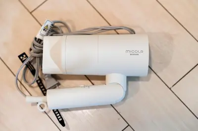 a white machine on the floor with cables at \u6e0b\u8c37\u533a\u3067\u306e\u5bbf\u6cca\u65bd\u8a2d \u99c5\u304b\u30893\u5206 in Tokyo