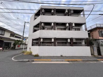an apartment building on the side of a street at Ojihoncho301 Triple Room in Tokyo
