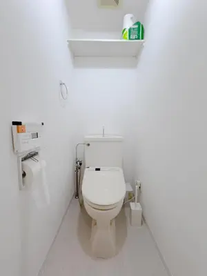 a bathroom with a toilet in a white room at Ojihoncho301 Triple Room in Tokyo
