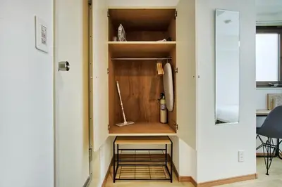 a closet in a room with a door open at CraftFlat Komagome 509, a compact studio at excellent location in Tokyo