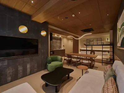 a living room with a couch and a dining room at illi Aest Shinagawa-Gotanda in Tokyo