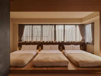 two beds in a room with two windows at illi Aest Shinagawa-Gotanda in Tokyo