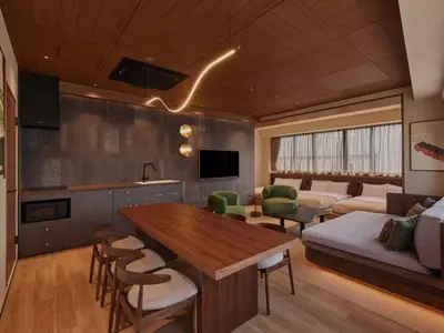 a kitchen and living room with a table and a couch at illi Aest Shinagawa-Gotanda in Tokyo