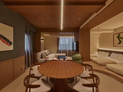a living room with a table and a couch at illi Aest Shinagawa-Gotanda in Tokyo