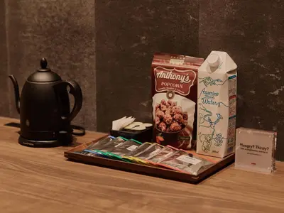 a table with a tea kettle and a box of cereal at illi Aest Shinagawa-Gotanda in Tokyo