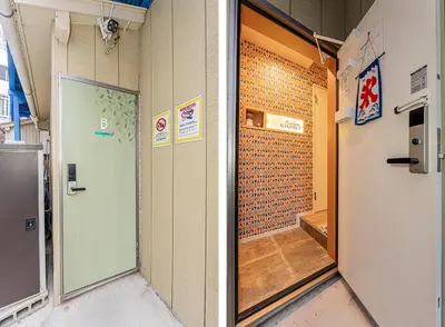 a hallway with a door in a room with a wall at Tokyo Skytree House 3LDK, 2Bath, 8 Guests, 6min to Keisei Hikifune in Tokyo