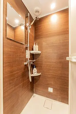 a bathroom with wood paneled walls and shelves at Tokyo Skytree House 3LDK, 2Bath, 8 Guests, 6min to Keisei Hikifune in Tokyo