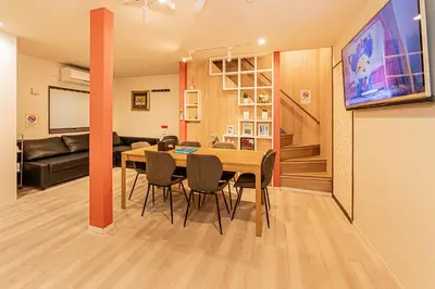 a dining room and living room with a table and chairs at Tokyo Skytree House 3LDK, 2Bath, 8 Guests, 6min to Keisei Hikifune in Tokyo