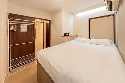 a bedroom with a large bed and a closet at Tokyo Skytree House 3LDK, 2Bath, 8 Guests, 6min to Keisei Hikifune in Tokyo