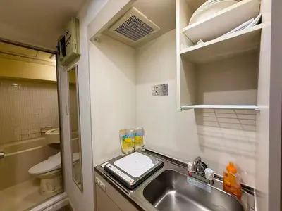 a small bathroom with a sink and a toilet at \u30e9\u30a4\u30aa\u30f3\u30ba\u30d7\u30e9\u30b6\u65b0\u5bbf1002 in Tokyo