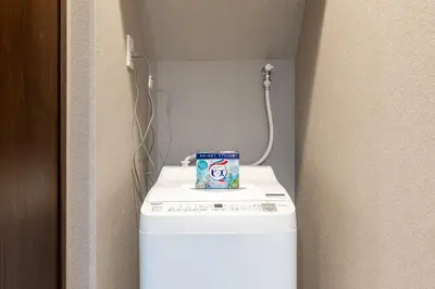 a washer and dryer with a can on top of it at Newly Opened \u6c60\u888b\u30c6\u30e9\u30b9\u30cf\u30a6\u30b9B in Tokyo